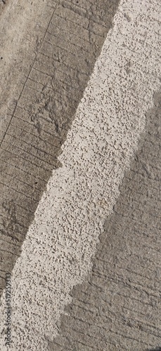concrete road surface with white stripe  