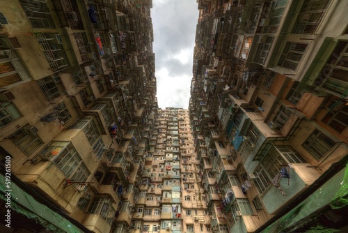 Low angle view of crowded residential towers in an old community in Quarry Bay  Hong Kong   Scenery of overcrowded narrow apartments  a phenomenon of high housing density   housing blues in HK
