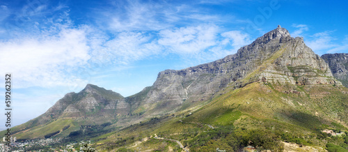 Panoramic view of Table Mountain against a cloudy blue sky with copyspace. Vibrant, beautiful landscape of nature. A popular location in Cape Town for travel, hiking and adventure