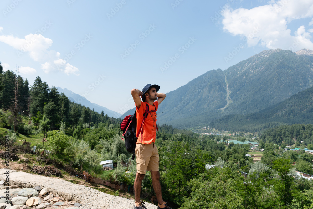 Hiker in the mountains, Betaab Valley, Pahalgam, Jammu and Kashmir, India. Hiker in the mountains, Betaab Valley, Pahalgam, Jammu and Kashmir, India.