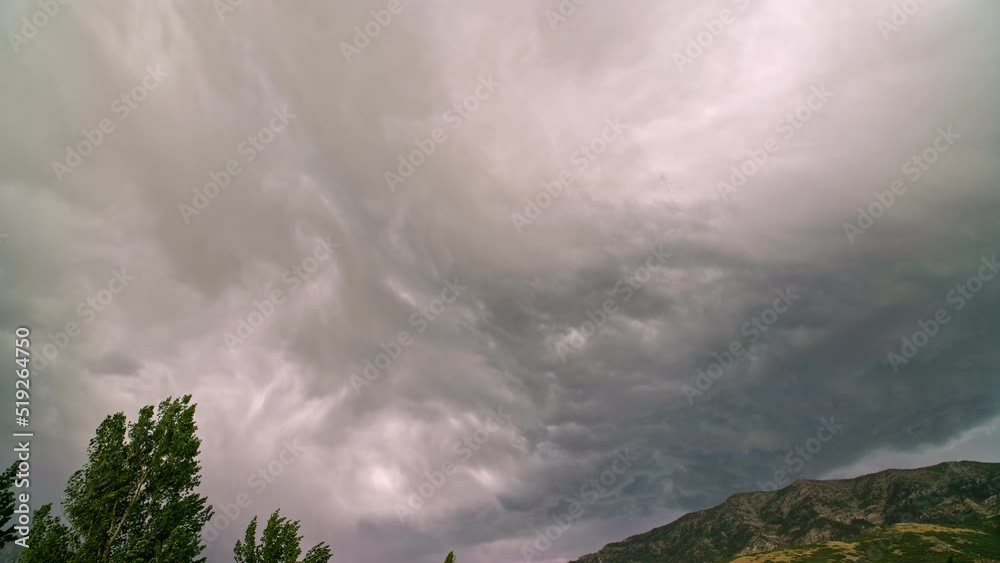 Storm clouds moving in timelapse over Cascade Mountain in Utah during extreme weather warning. Storm clouds moving in timelapse over Cascade Mountain in Utah during extreme weather warning.