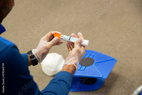 Staff training to inject an epinephrine as first aid photo