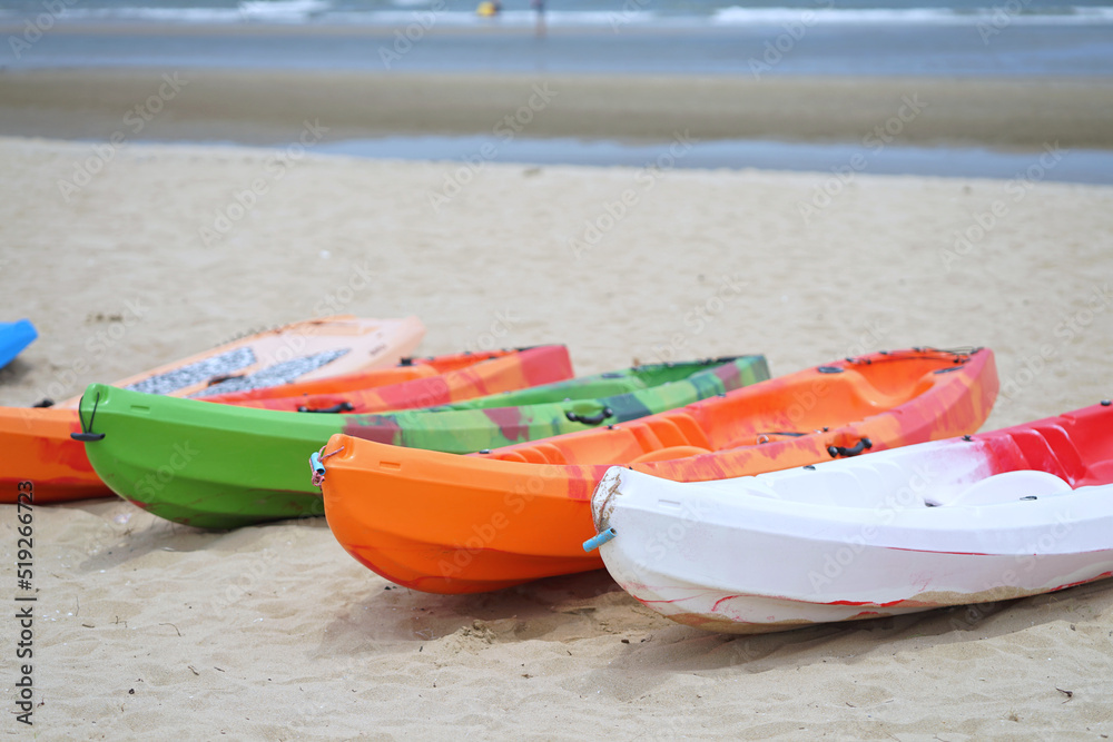 Colorful kayaks on the beach in the Summer season. Colorful kayaks on the beach in the Summer season.