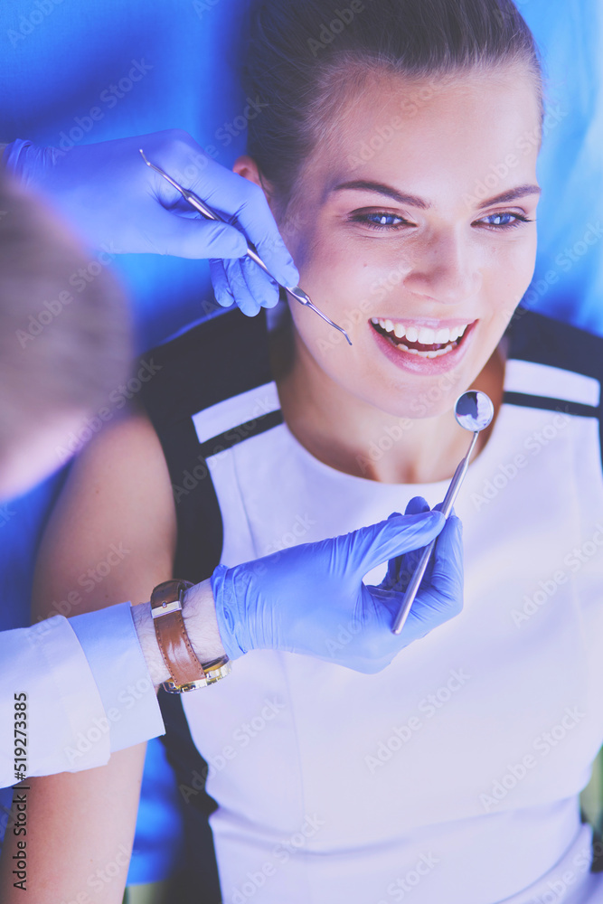 Young Female patient with open mouth examining dental inspection at dentist office. Young Female patient with open mouth examining dental inspection at dentist office.