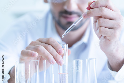 Male Scientist Looking Vaccine