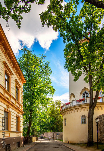 Narrow street with old and medieval buildings in  European town