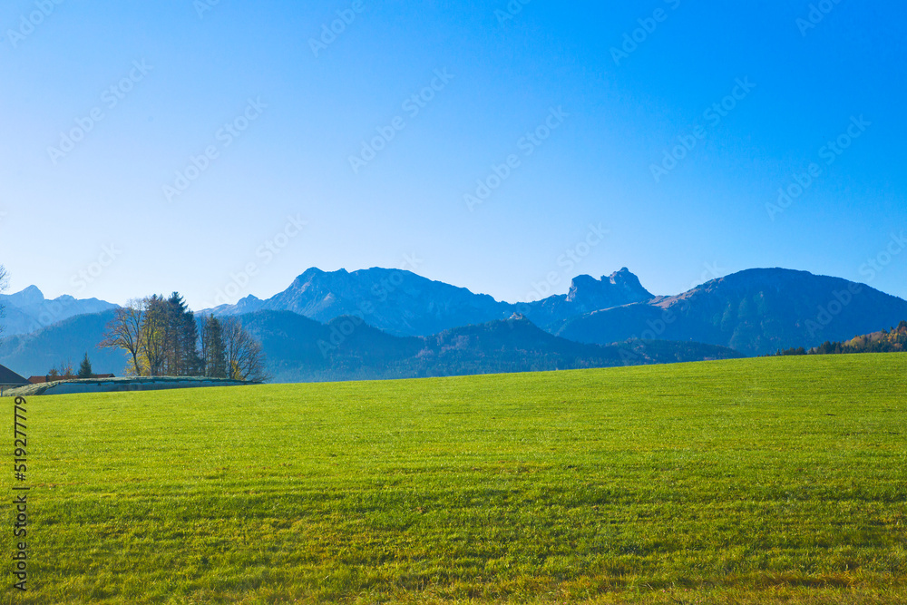 Looking out the window train moving through the German countryside near Fussen.