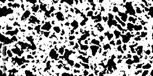 Black-white cowhide as a seamless pattern. Spotted vector background. Animal print with abstract dots. Panda, dalmatian or appaloosa horse skin texture. photo