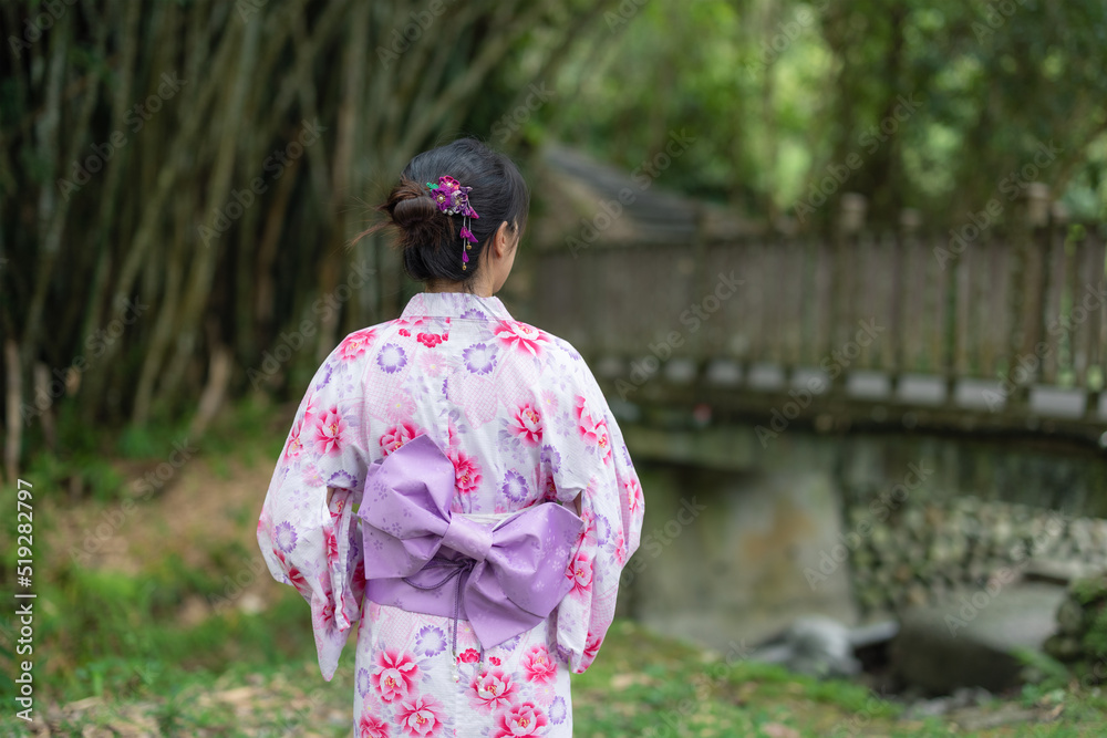 Japanese woman wear yukata at outdoor park