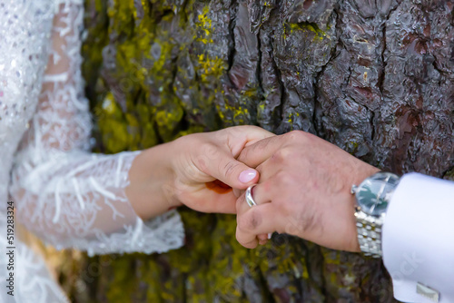 Afghani married couple's holding hands close up