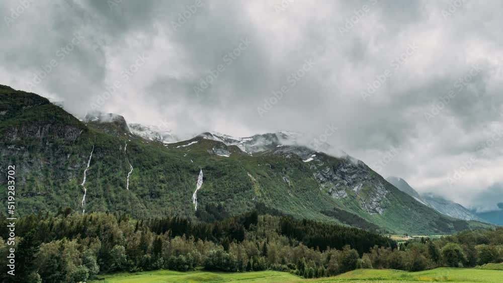 Stardalen, Skei I Jolster, Jostedalsbreen National Park, Norway. Waterfall In Norwegian Summer Landscape. Time-lapse 4k. Stardalen, Skei I Jolster, Jostedalsbreen National Park, Norway. Waterfall In Norwegian Summer Landscape. Time-lapse 4k.
