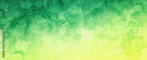Yellow and green watercolor background with blobs of paint and old vintage watercolor paper texture grain