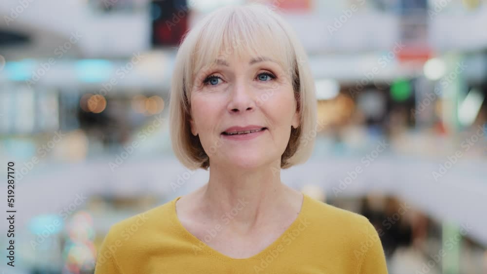 Female portrait happy dreamy mature middle aged caucasian woman thinking dreaming of carefree future serene smiling close-up cute elderly lady grandma standing indoors enjoying memory deep in thought Female portrait happy dreamy mature middle aged caucasian woman thinking dreaming of carefree future serene smiling close-up cute elderly lady grandma standing indoors enjoying memory deep in thought