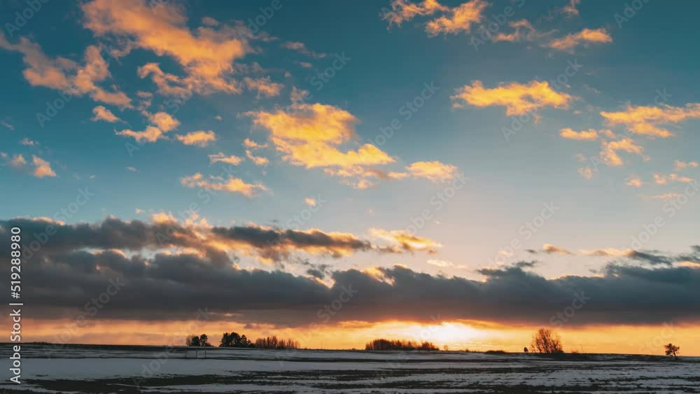 Winter Meadow Field At Evening Sunset. Natural Bright Dramatic Sky Colours Above Countryside Snowy Landscape. Agricultural Landscape In January. Time Lapse Time-lapse Timelapse. Winter Meadow Field At Evening Sunset. Natural Bright Dramatic Sky Colours Above Countryside Snowy Landscape. Agricultural Landscape In January. Time Lapse Time-lapse Timelapse.