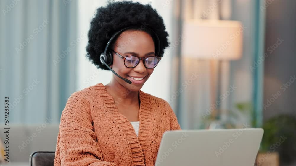 A freelance call center agent consulting a client while working from home. Happy and young African female customer service employees talking to a customer on a video call doing remote work