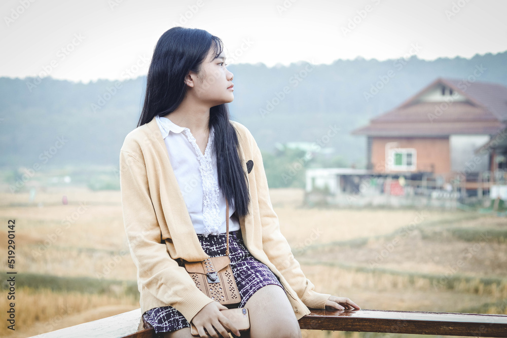 Fototapeta premium girl sitting in the countryside morning 2