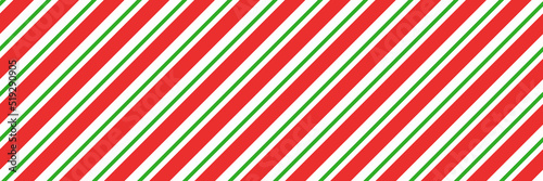 Christmas candy cane striped seamless pattern. Christmas candycane background with red and green stripes. Peppermint caramel diagonal print. Xmas traditional wrapping texture. Vector illustration.
