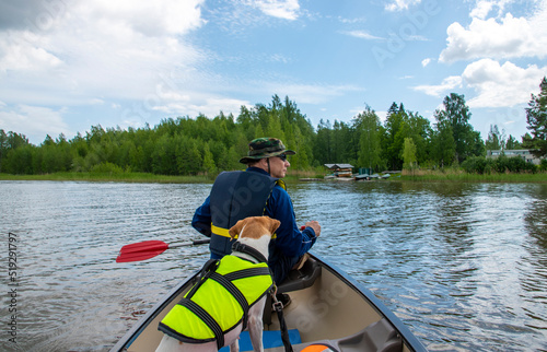 Canoeing at lake with dogs
