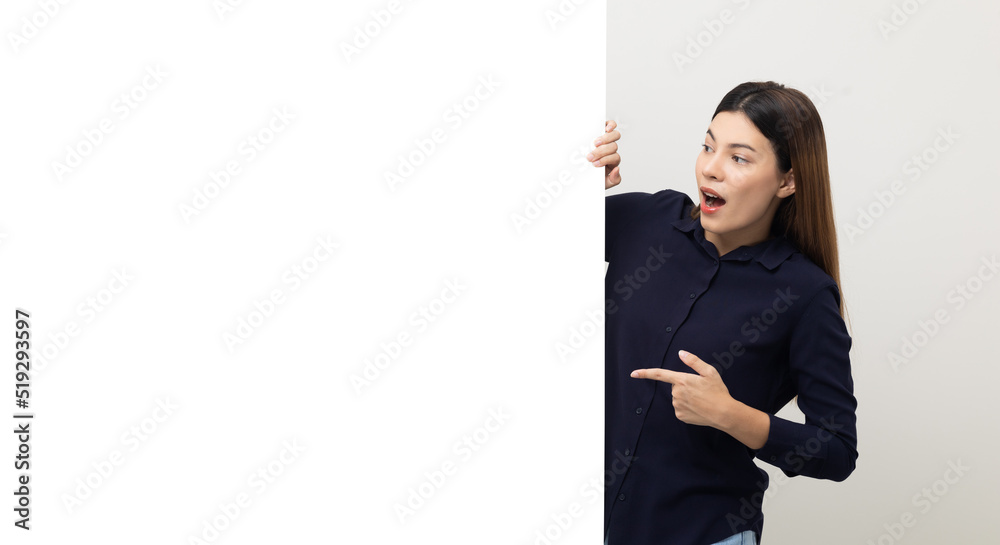 Portrait of Young beautiful mixed race woman standing and smiling on isolated white background with big mockup billboard for advertising text. Portrait of Young beautiful mixed race woman standing and smiling on isolated white background with big mockup billboard for advertising text.
