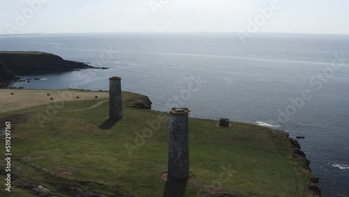 Morning aerial at cliff top nautical marker towers and ocean horizon photo