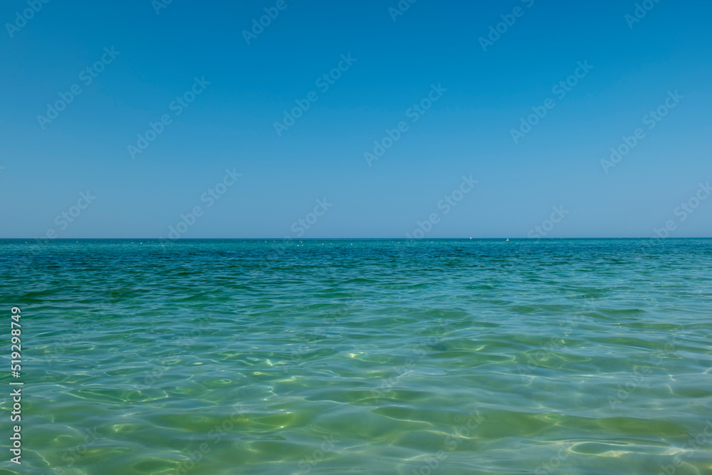 Fototapeta premium View of the clear sea and blue skies. Beautiful seascape. Waves of water on the sea
