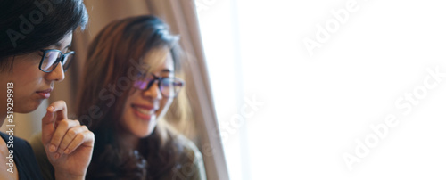 Two entrepreneur Asian woman glasses working from anywhere with laptop