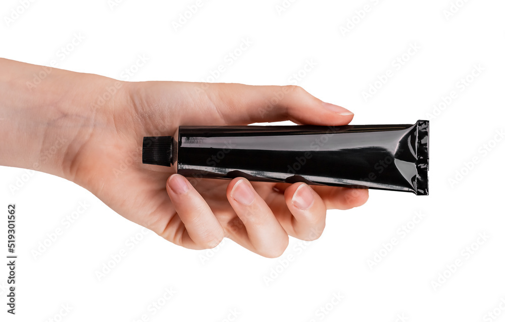 Hand holding cream tube mockup isolated on white background. Skin care, cosmetics concept. Black template. High quality photo Hand holding cream tube mockup isolated on white background. Skin care, cosmetics concept. Black template. High quality photo