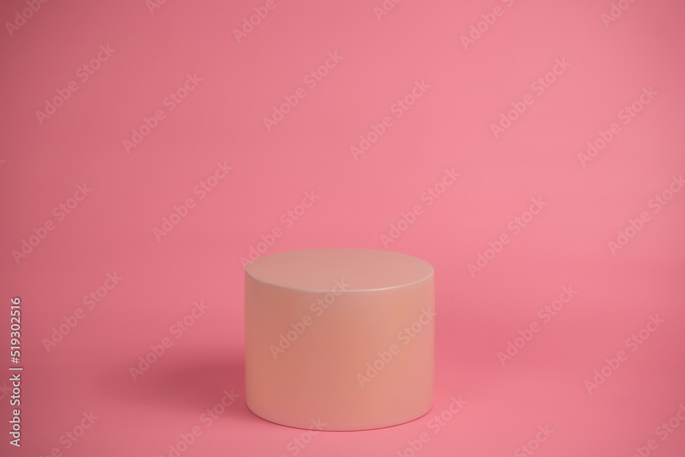 Empty podium for display cosmetic product. Platform arrangement in pink pastel color in trendy minimalist style. Composition of cylinders and cubes layout for feminine background Empty podium for display cosmetic product. Platform arrangement in pink pastel color in trendy minimalist style. Composition of cylinders and cubes layout for feminine background