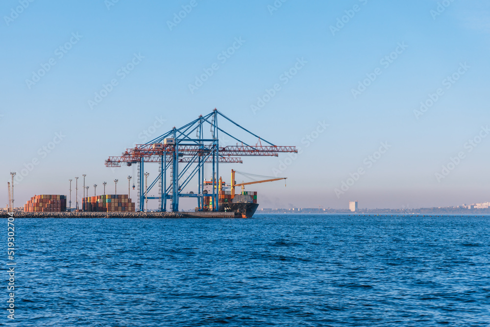 Loading cargo in the seaport. Marine industrial trade port. Black Sea. Export and import by sea. City of Odessa, Ukraine