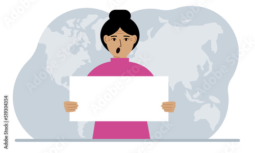 The concept of world attention. A woman holds a white poster in his hands against the background of a world map.