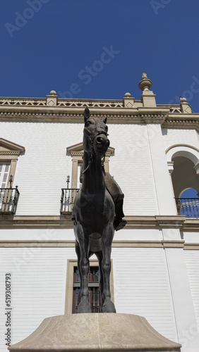 Seville, Spain, September 12, 2021: Equestrian monument dedicated to María de las Mercedes de Borbón-Dos Sicilias y Orléans at the entrance of the Real Maestranza de Sevilha. photo