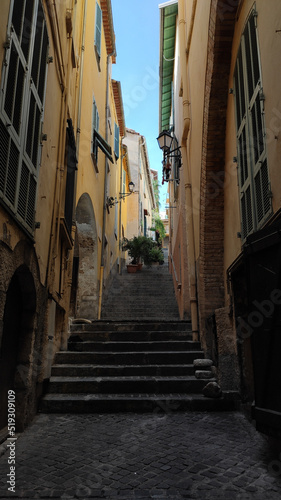 Narrow street and stairs Escalinada del Pountin street in Villefranche-sur-Mer, France.