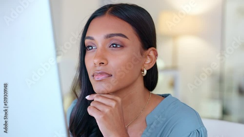 Business analyst thinking, reading or analysing data on computer to predict financial profit, loss or plan strategy. Content businesswoman nodding in agreement over progress statistics on technology