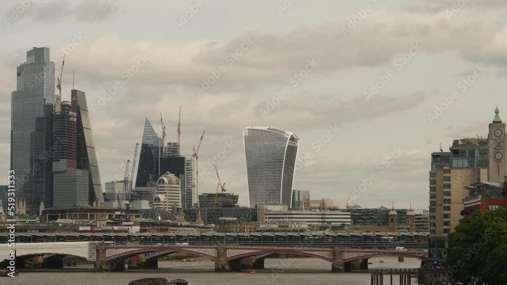 Cityscape across Thames river of bridge, skyscrapers and Walkie Talkie building. London, United Kingdom. Cityscape across Thames river of bridge, skyscrapers and Walkie Talkie building. London, United Kingdom.