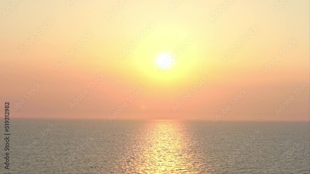 Evening Sun Above Tropical Sea and Orange Misty Horizon Evening Sun Above Tropical Sea and Orange Misty Horizon