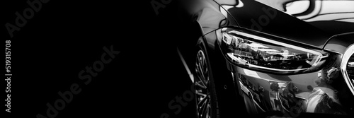 banner. car headlight on a black background. dealer center.