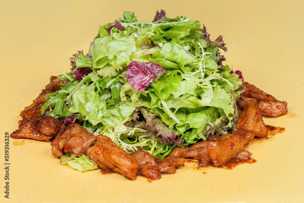 Chicken wings in teriyaki sauce with lettuce leaves Chicken wings in teriyaki sauce with lettuce leaves