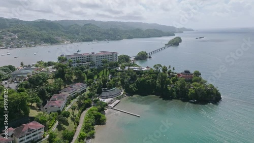 Fly Over Samana Town Beach ~ Playa Cayacoa In Santa Barbara de Samana Overlooking Puente De Cayo Samana In Dominican Republic. Aerial Drone Shot photo