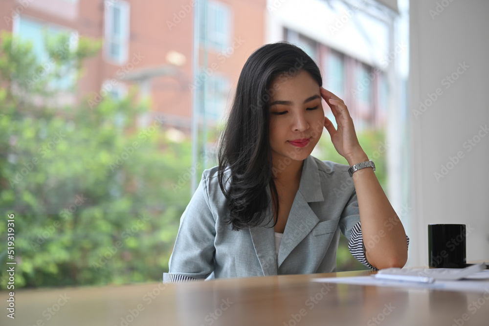 Frustrated young businesswoman having problems at work, feeling dissatisfied with financial report