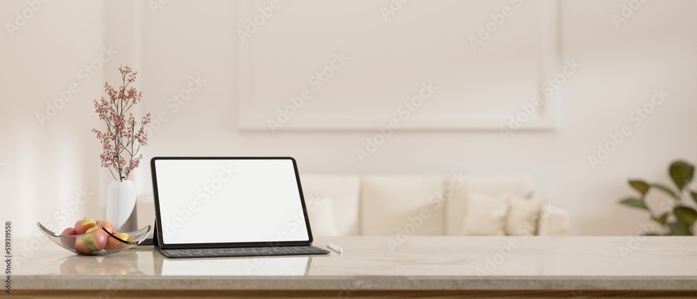 White marble tabletop with tablet mockup and copy space over blurred minimal white living room