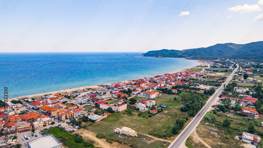 Amazing long coast full of summer houses with red roofs. Perfect summer destination. Clear turquoise sea. High quality photo