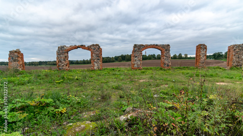 The stone and brick ruins are an unofficial tourist attraction reminiscent of the famous Stonehenge in Britain. It is located in an open field on the outskirts of Smiltene, Latvia photo