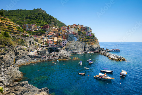 Travel to Cinque Terre (English Five Lands). Aerial view over Manarola architecture landmark village at the coast of Liguria Sea from Italy. 