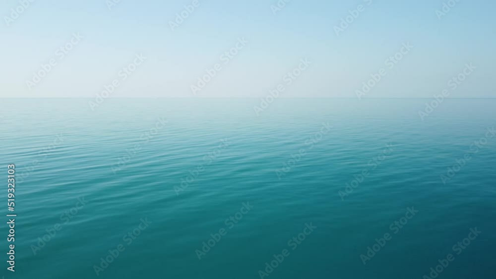 Abstract aerial sea summer ocean sunset nature background. Small waves on azure water surface in motion blur with golden bokeh lights from sun. Holiday, vacation and recreational concept. Slow motion Abstract aerial sea summer ocean sunset nature background. Small waves on azure water surface in motion blur with golden bokeh lights from sun. Holiday, vacation and recreational concept. Slow motion