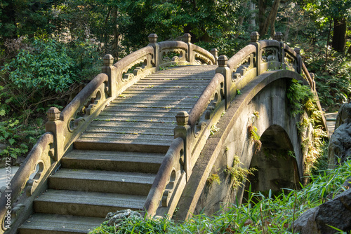 Edo period stone Full Moon Bridge in the Koishikawa Korakuen Gardens in Tokyo, Japan photo