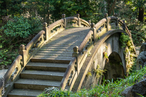Edo period stone Full Moon Bridge in the Koishikawa Korakuen Gardens in Tokyo, Japan