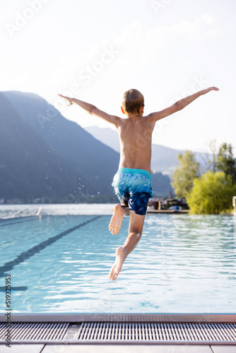 Kid having fun at the pool during the summer