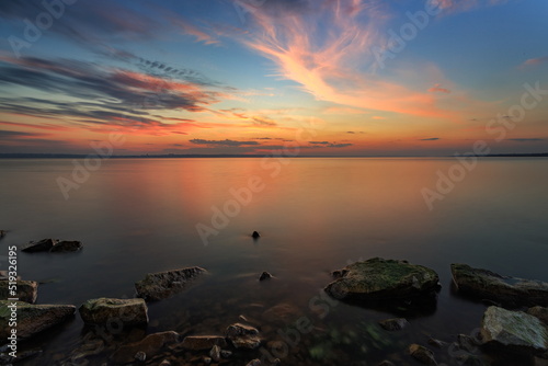 Long exposure sunset over the lake, soft focus © pobaralia