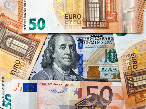 Background of one hundred dollar bills and fifty Euro bills close-up