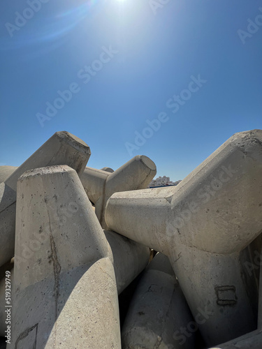 Tetrapod breakwater wall in the mediterranean sea photo